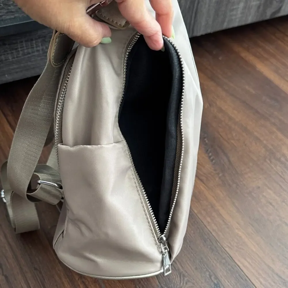 Neutral Taupe Woman’s Backpack with Metallic Accent and many zipper pockets. - Picture 7 of 13